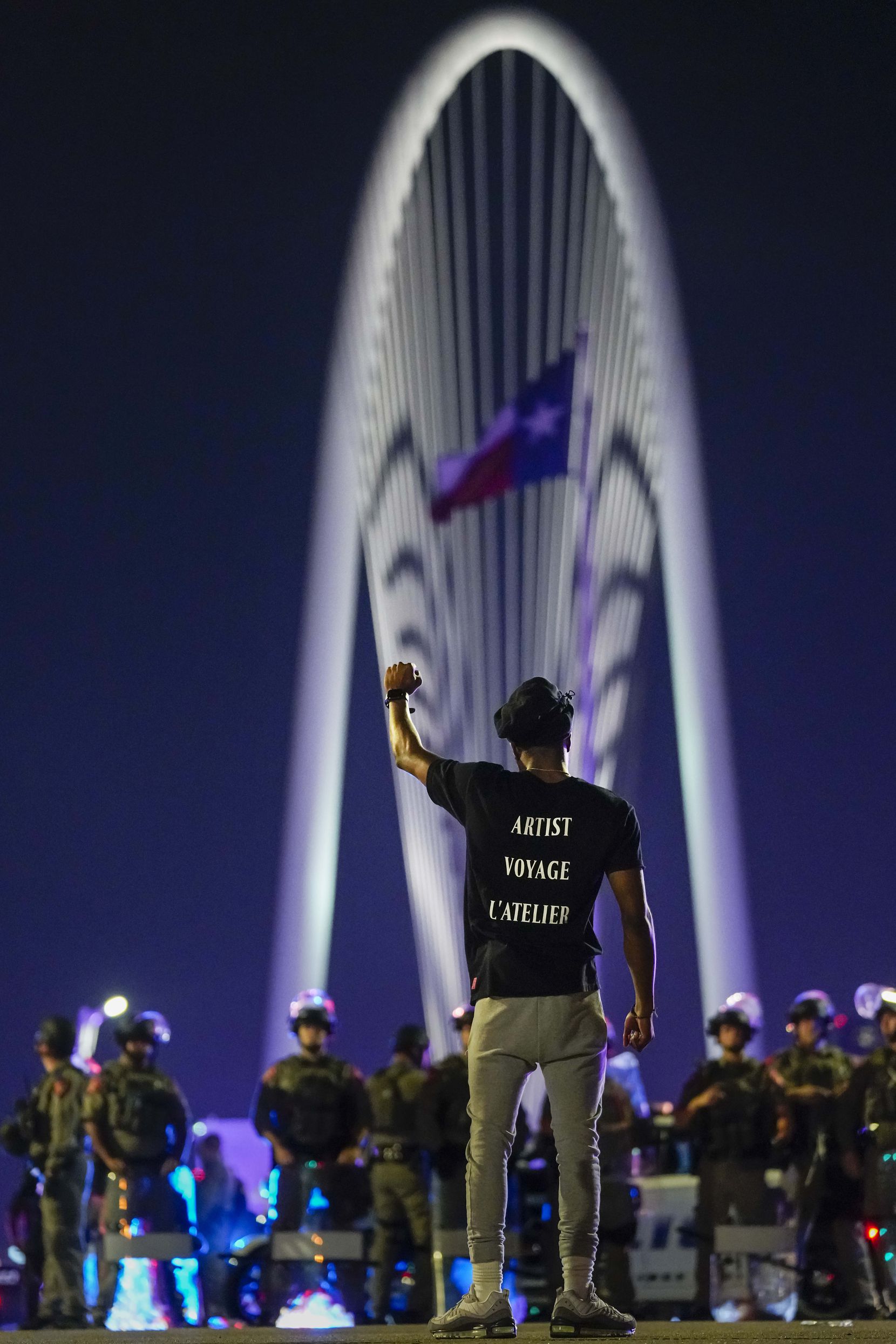 Devante Williamson stood in solidarity with protesters on the Margaret Hunt Hill Bridge as...