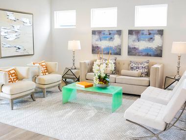 The main living area in a model home at the new Centre Living Homes neighborhood at Sparrow...
