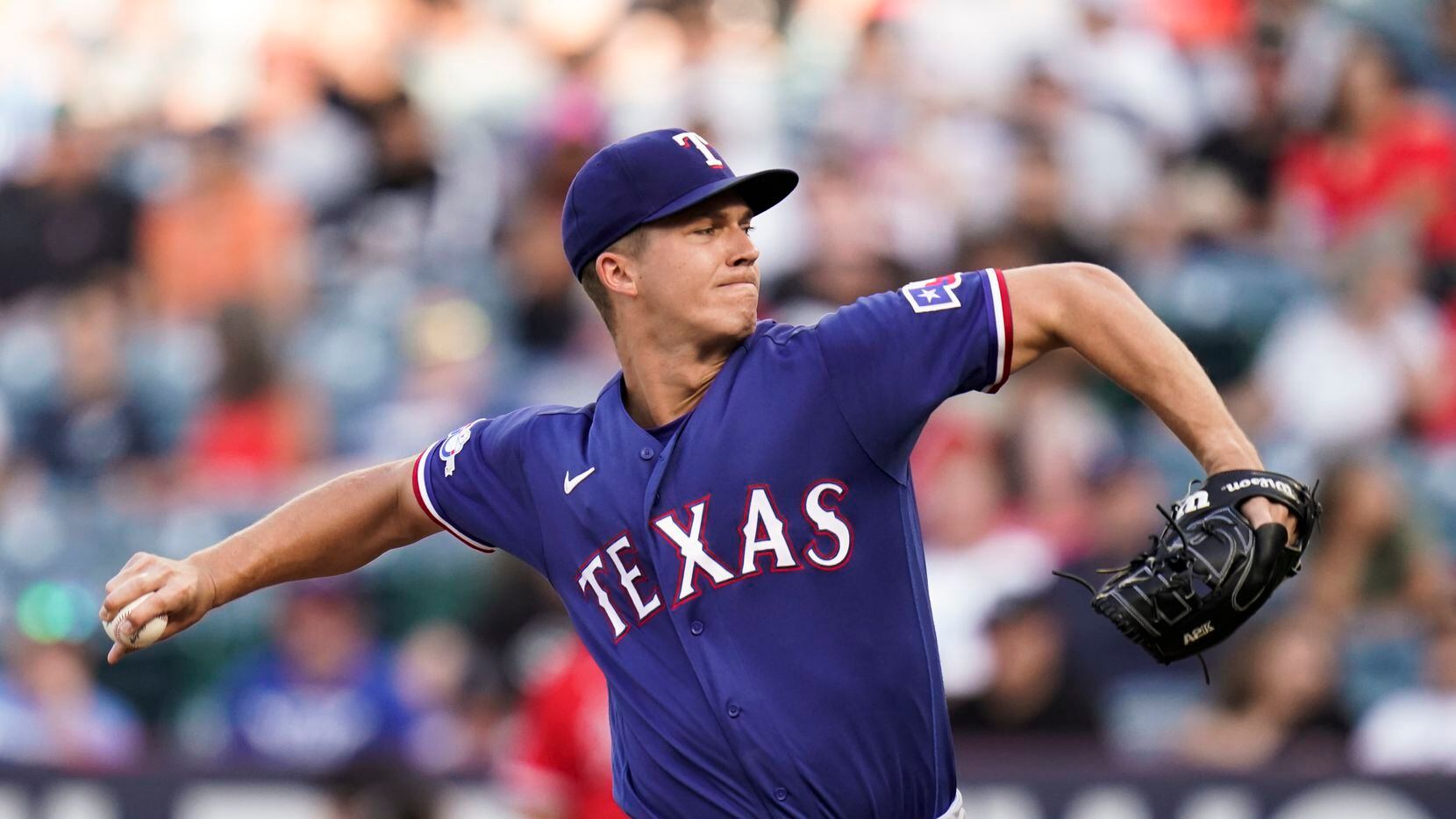 Texas Rangers starting pitcher Glenn Otto throws against the Los Angeles Angels during the...