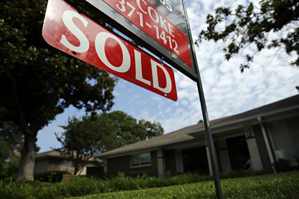 A sold sign in front of a home. Dallas-Fort Worth investors flipped 2,401 single-family...