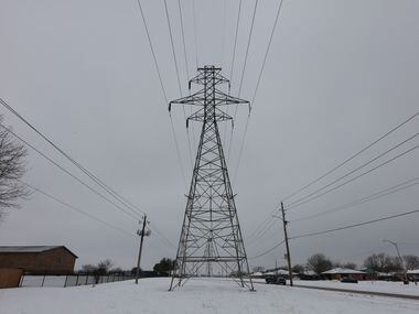 FORT WORTH, TX - FEBRAURY 17: A transmission tower supports power lines after a snow storm on Febraury 17, 2021 in Altamesa Blvd., and Crowley Rd. in Fort Worth, Texas.