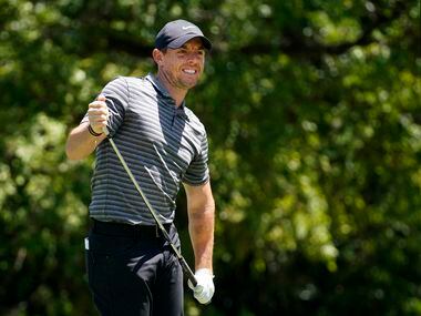PGA Tour golfer Rory McIlroy watches his tee shot go right down the ninth fairway during the...