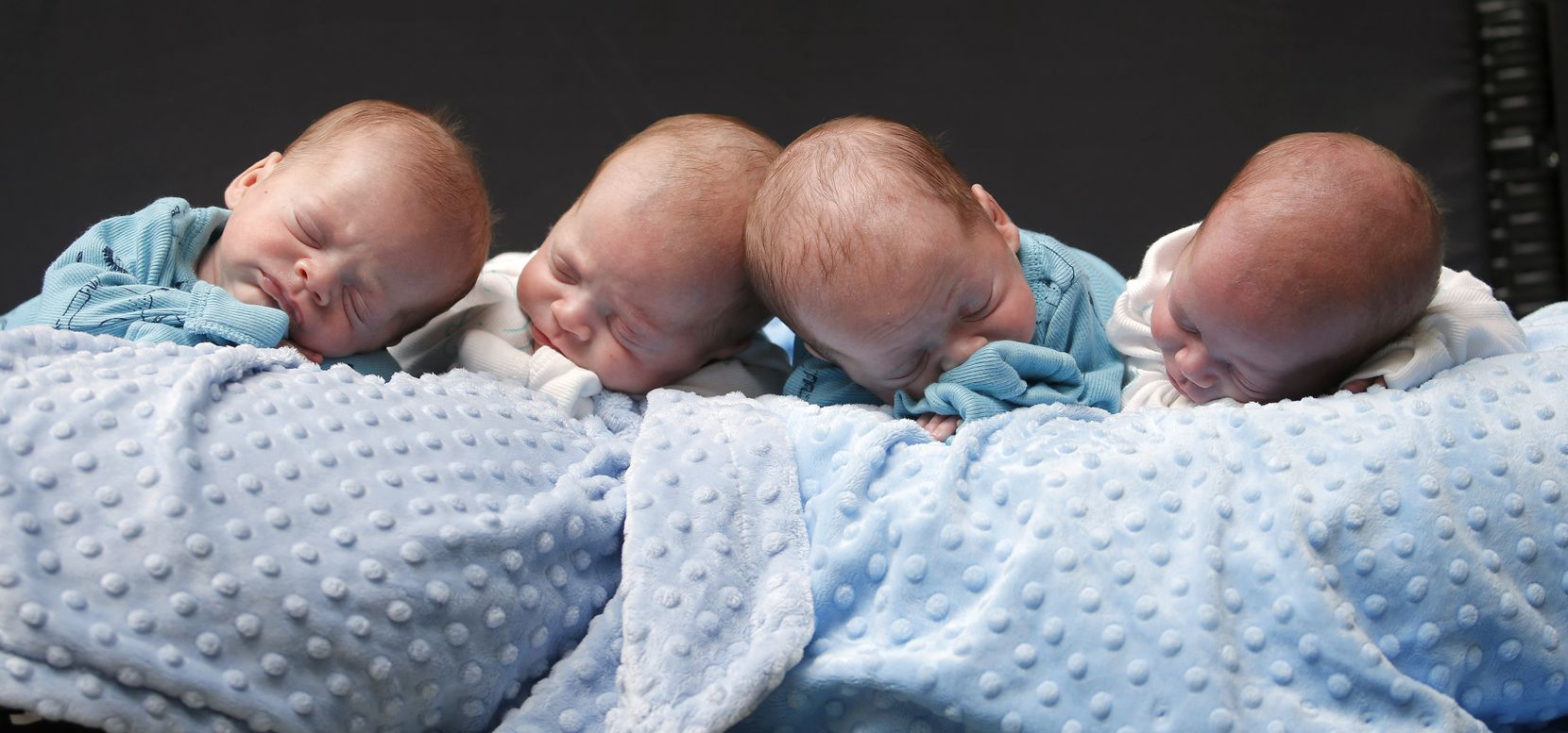 Identical quadruplets (from left) Harrison, Hardy, Henry and Hudson Marr snuggled for a...