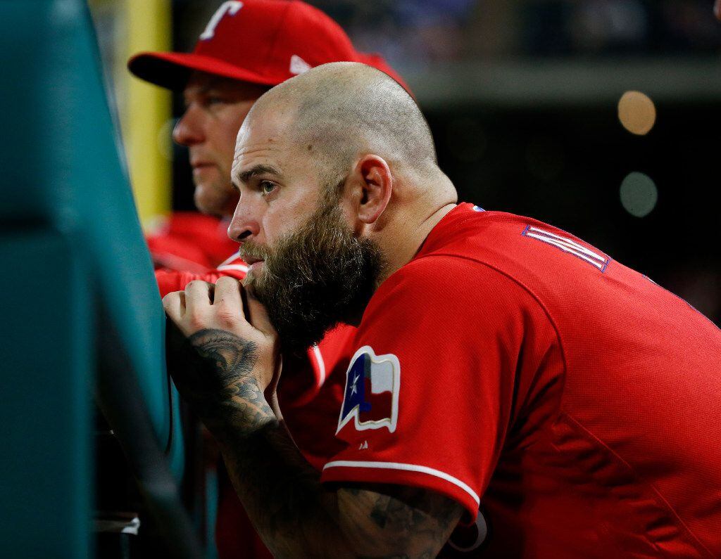 Texas Rangers first baseman Mike Napoli (5) watches the game in the ninth inning against the...