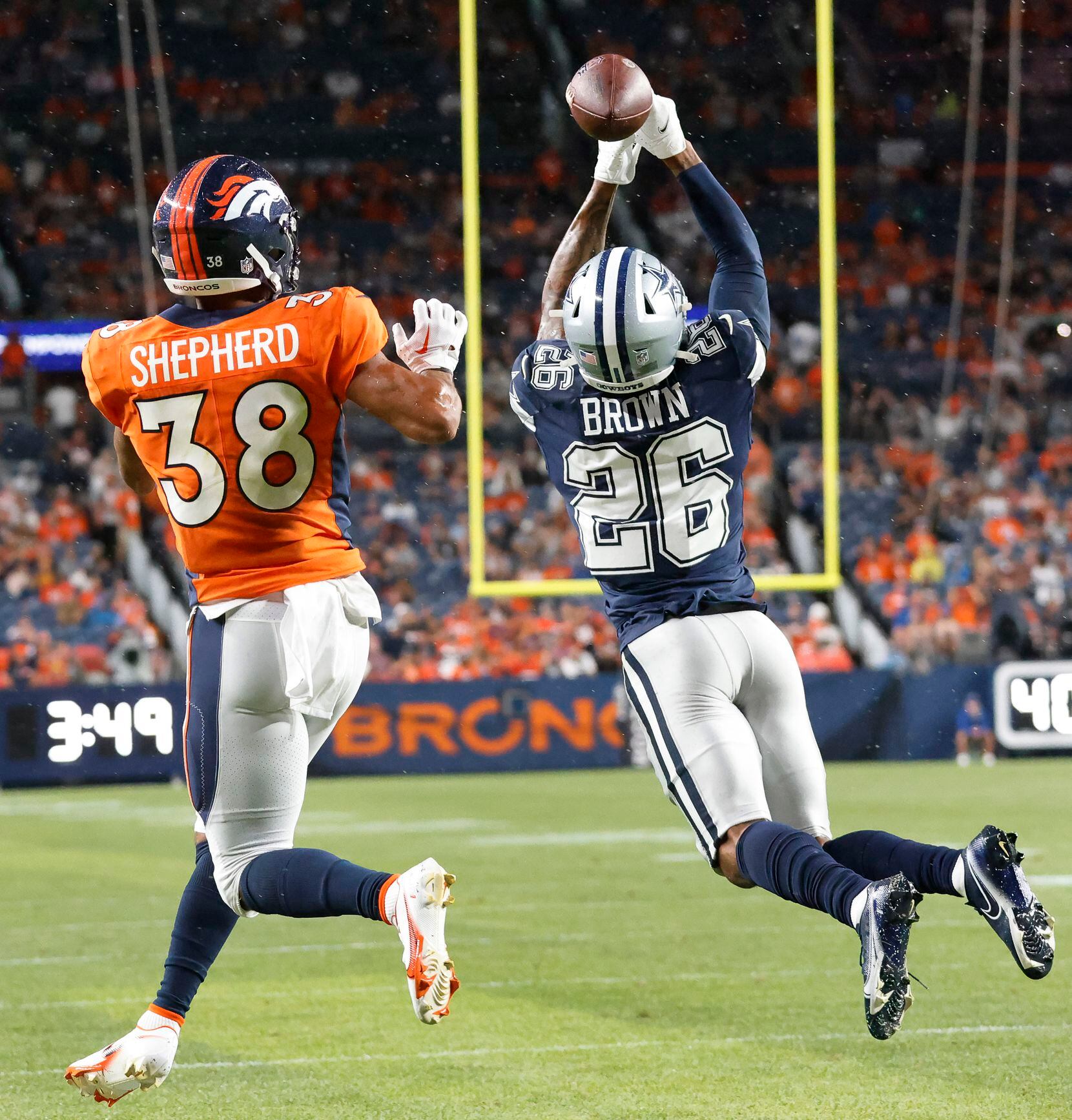 Dallas Cowboys cornerback Kyron Brown (26) nearly intercepts a pass intended for Denver...