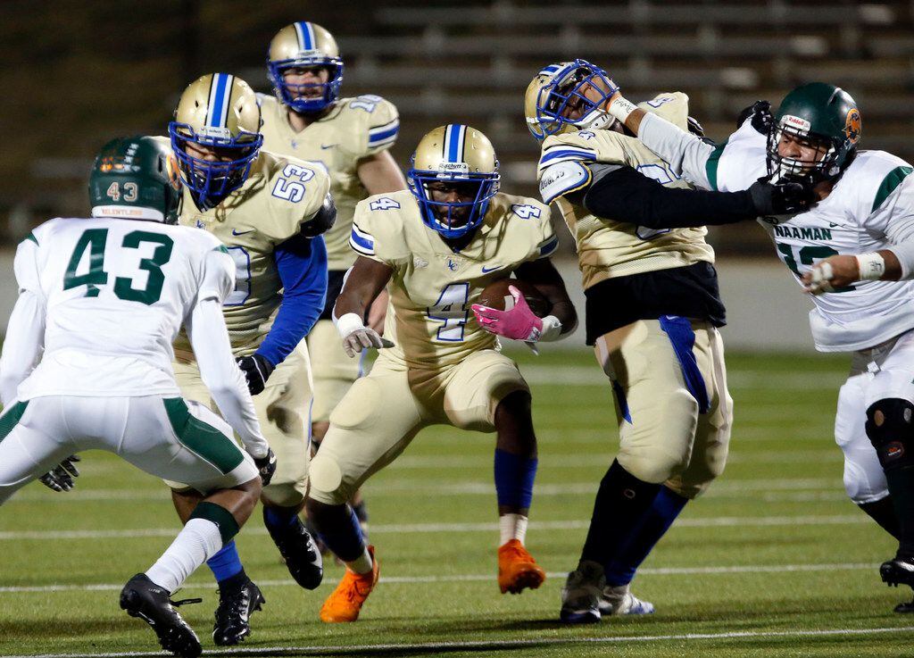 Lakeview RB Camar Wheaton (4) tries to find an open running lane through a determined Naaman...