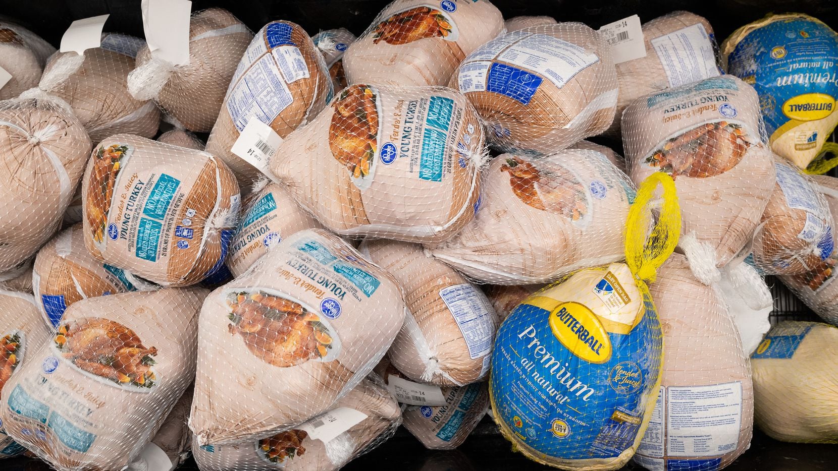 A refrigerated case of frozen turkeys photographed last Thanksgiving at Kroger on...