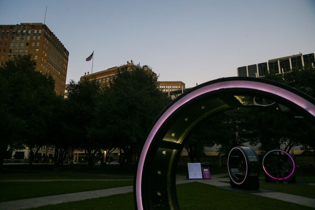Rings are illuminated at dusk for the "Loop" interactive art display at Burnett Park in Fort...