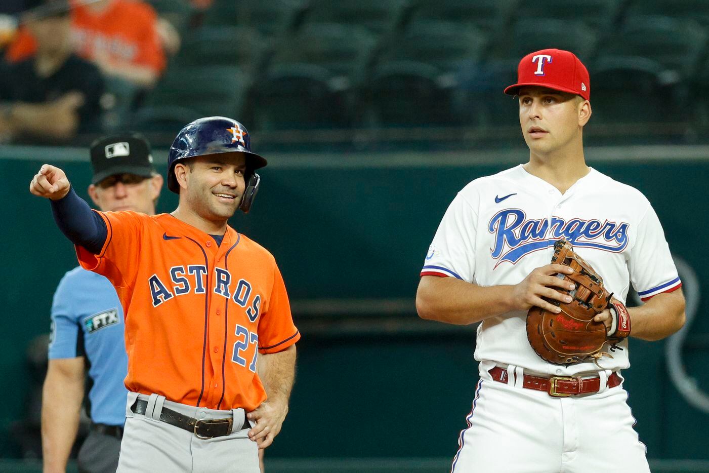 Houston Astros second baseman Jose Altuve (27) talks with Texas Rangers first baseman...