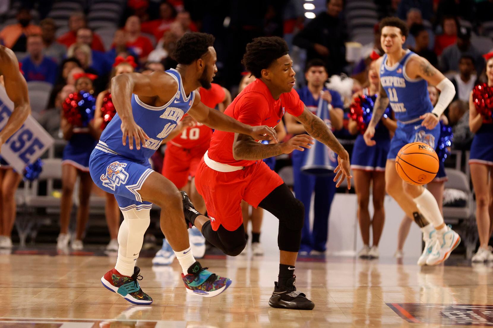 SMU guard Kendric Davis (3) tries to steal th ball from Memphis guard Alex Lomax (10) during...