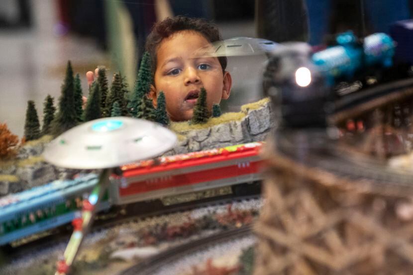 Dylan Patel, 3, watches in awe as the trains roll by while visiting the Trains at NorthPark...