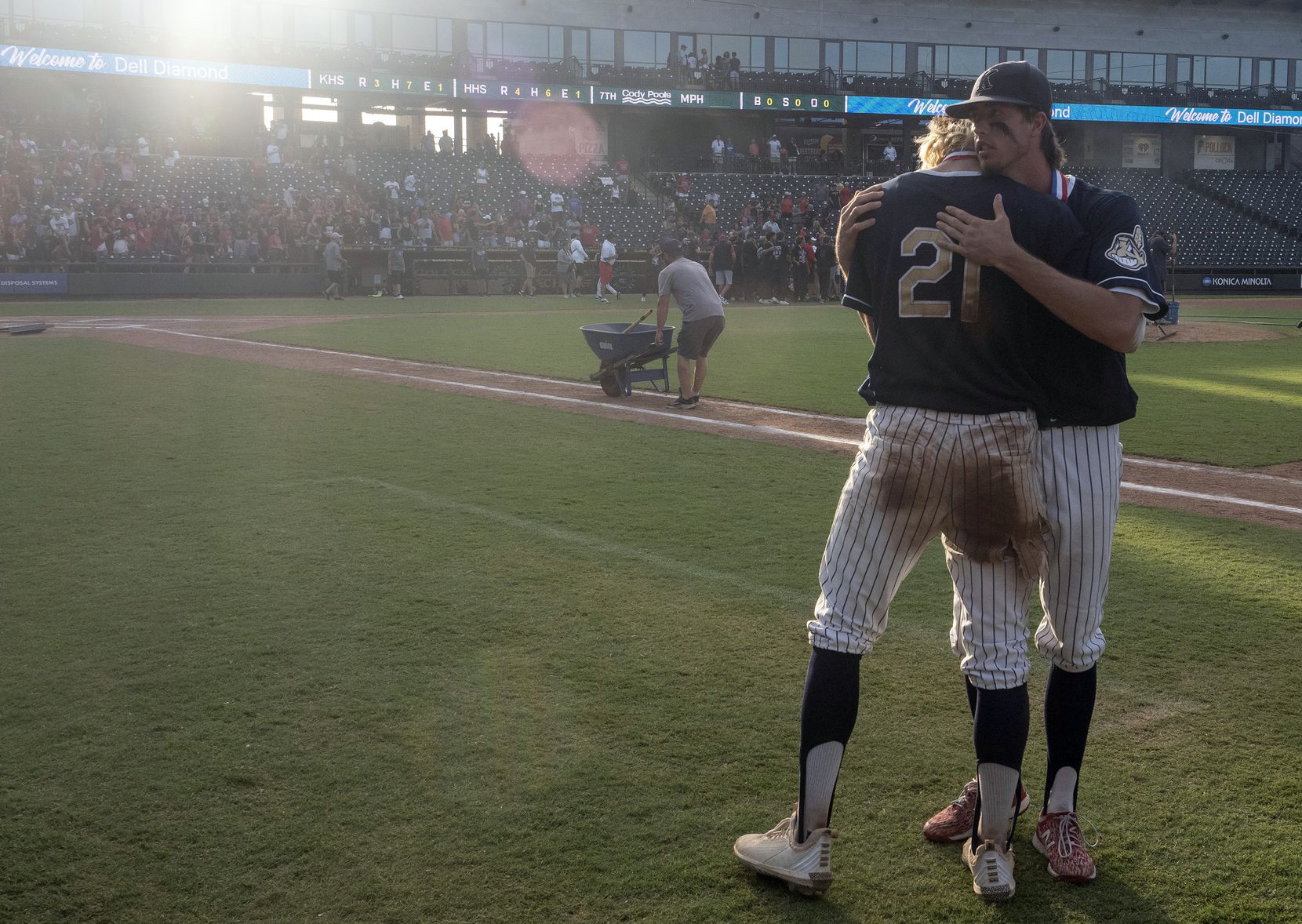 Keller Eric Hammond, (27),  gives teammate, Zach Rike, (21), a hug after coming up short against Rockwall-Heath during the 2021 UIL 6A state baseball final held, Saturday, June 12, 2021, in Round Rock, Texas.  Rockwall-Heath defeated Keller 4-3.   (Rodolfo Gonzalez/Special Contributor) 