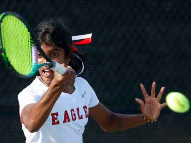 Argyle’s Meghna Arun Kuma hits a return shot during the 4A girls singles championship match...
