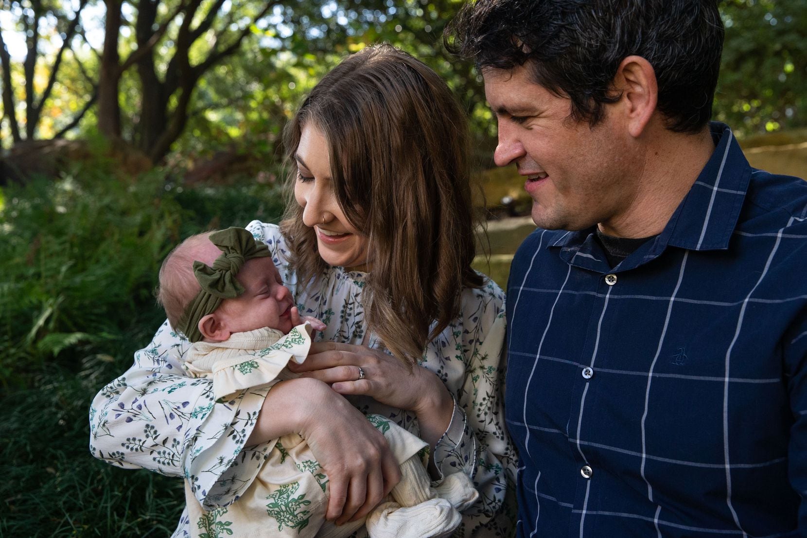 Marianne Wood-Clark and her husband, Christopher Clark, hold their 2-month-old baby, Lydia...