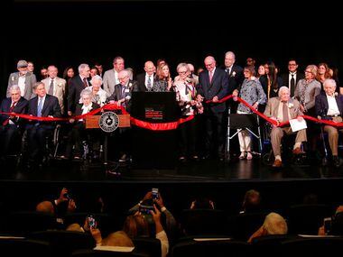 A host of dignitaries join museum staff and Holocaust survivors onstage for Tuesday's...