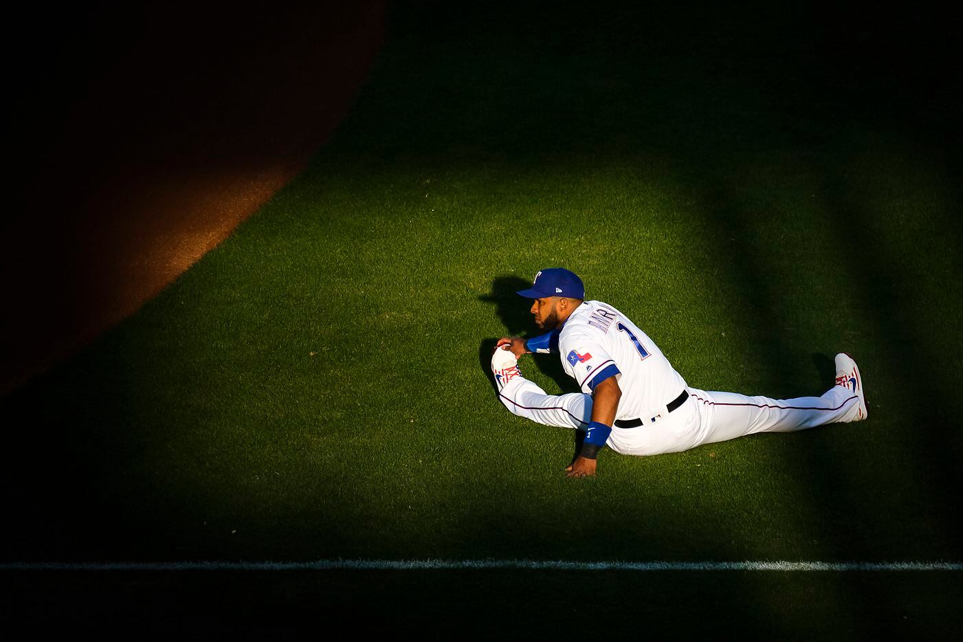 Texas Rangers shortstop Elvis Andrus stretches  before a game against the Houston Astros at...