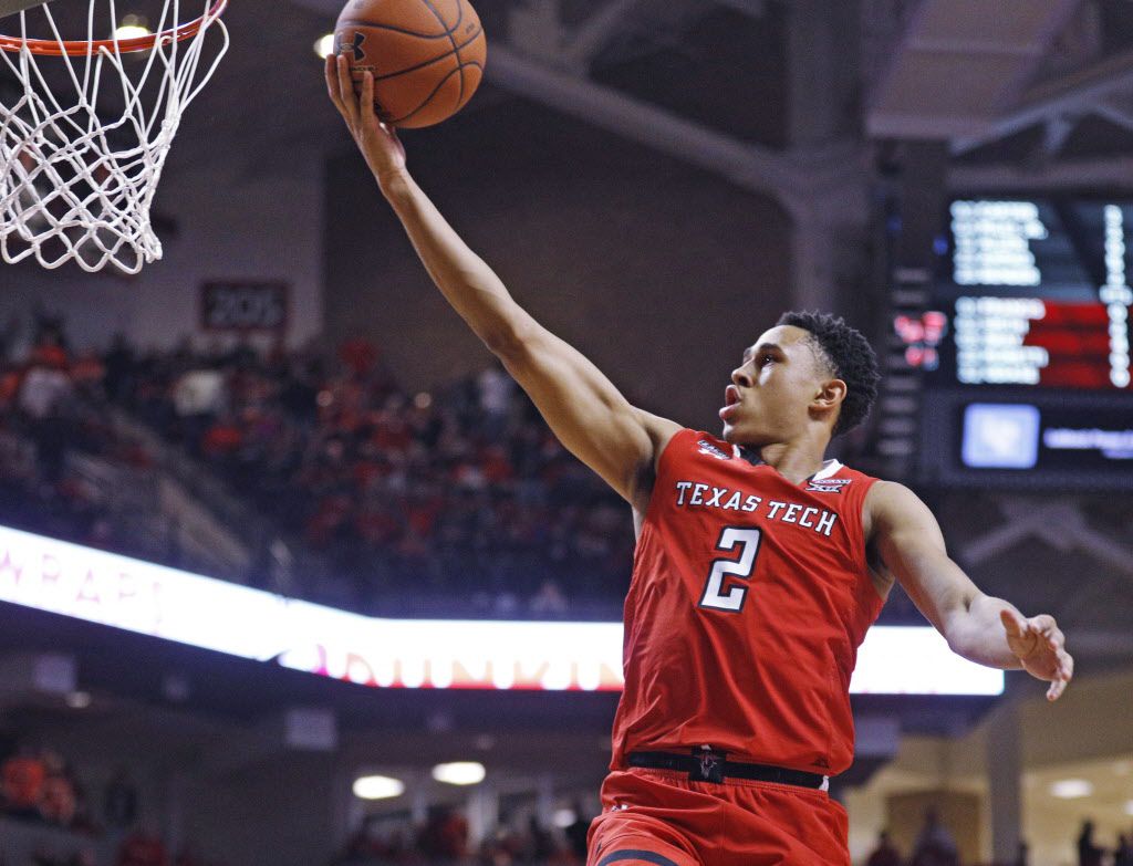 Texas Tech's Zhaire Smith (2) lays up the ball during the first half of an NCAA college...