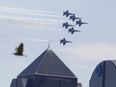 The U.S. Navy Blue Angels fly over the Dallas skyline on Wednesday, May 6, 2020.