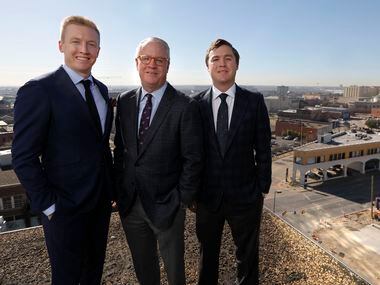 Shawn Todd, founder and CEO of Todd Interests, center, with his sons, Patrick, left, and...
