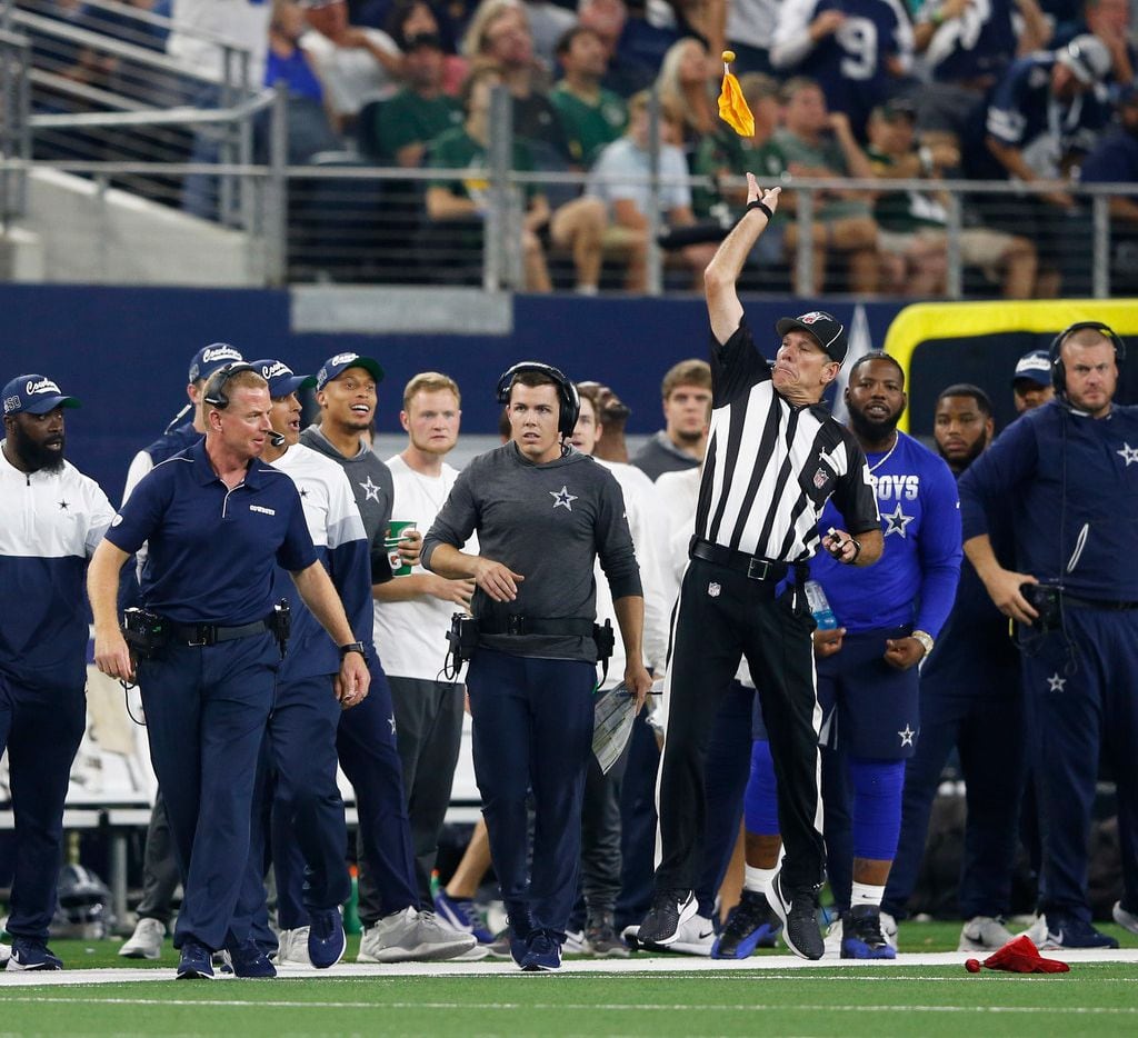 Side judge Scott Edwards (3) throws a penalty flag after Dallas Cowboys head coach Jason Garrett threw a challenge flag during the second half of play at AT&T Stadium in Arlington, Texas on Sunday, October 6, 2019. The Green Bay Packers defeated the Dallas Cowboys 34-24. (Vernon Bryant/The Dallas Morning News)