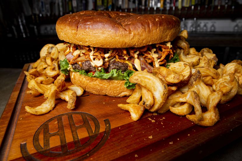 Happiest Hour has a giant menu, literally: Here's a 5-pound Big Happy Burger and 5 pounds of...