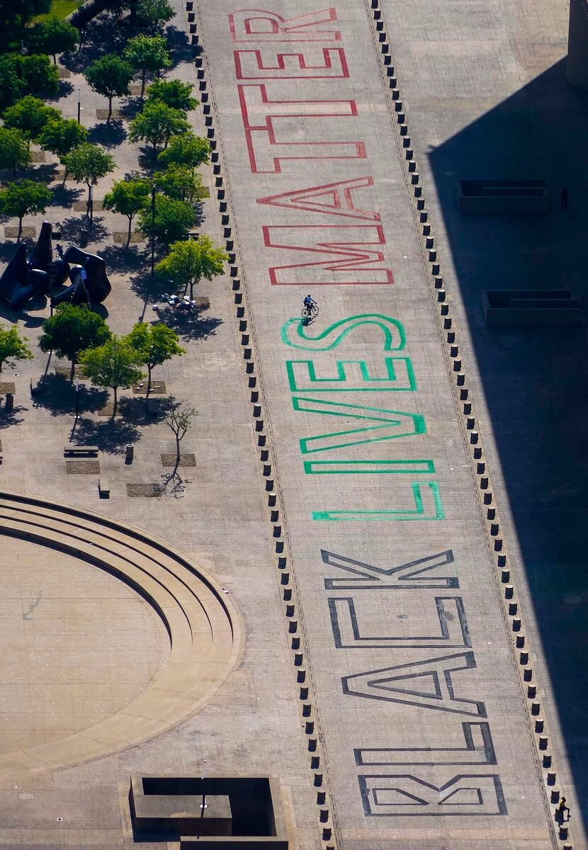 Aerial view of the words 'Black Lives Matter' seen painted on the plaza in front of Dallas...