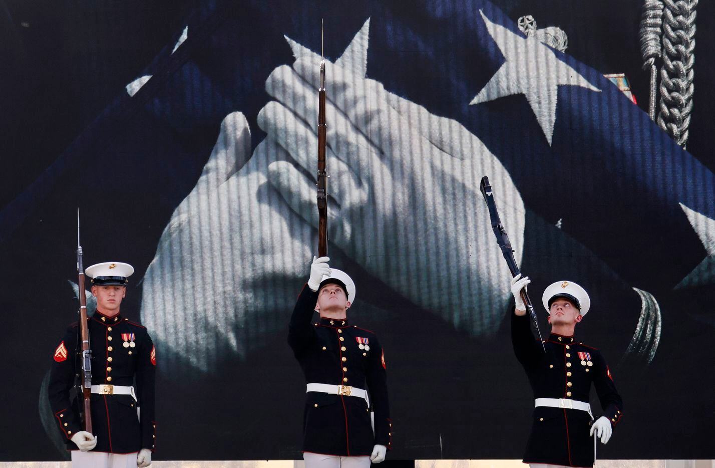 Members of the U.S. Marine Corps Silent Drill Team from Marine Barracks Washington, D.C.,...