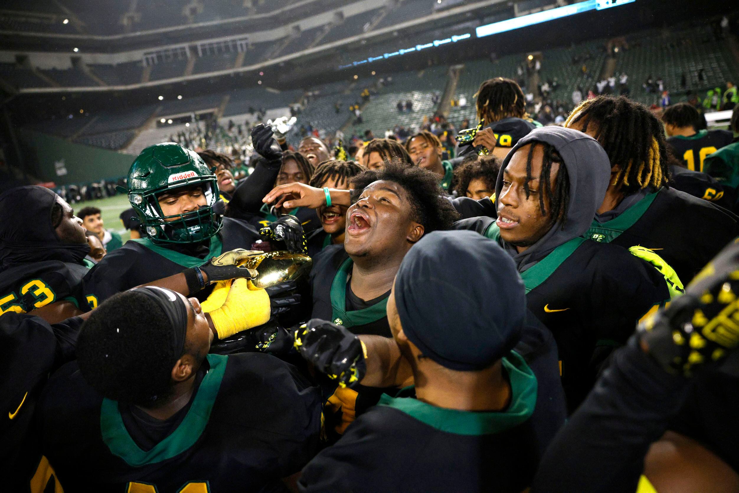DeSoto players celebrate after their 42-20 victory against Wylie East at a Class 6A Division...