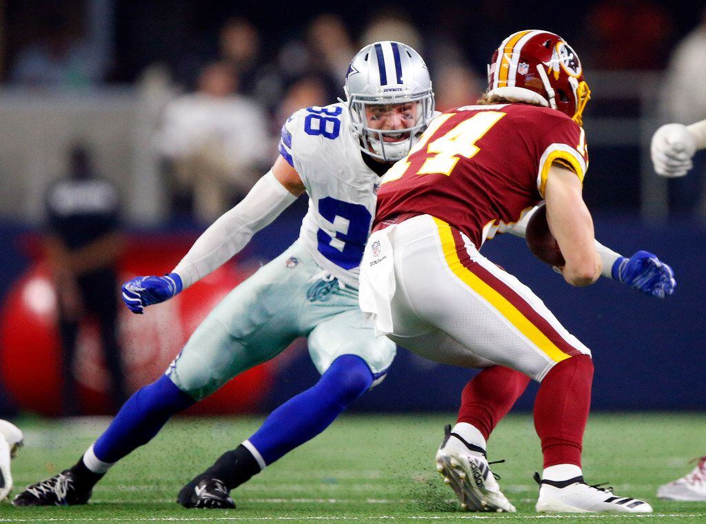 FILE - Dallas Cowboys strong safety Jeff Heath (38) puts the hit on Washington Redskins wide...