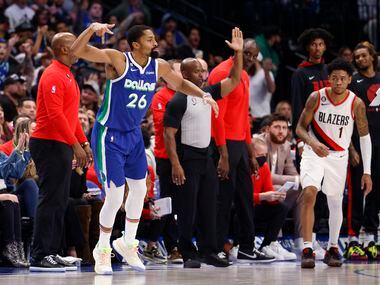 Dallas Mavericks guard Spencer Dinwiddie (26) celebrates after a three-point shot during the...