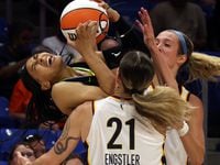 Dallas Wings guard Allisha Gray (15), loses her goggles but not the ball as Indiana Fever...