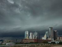 Storm clouds rolled over the downtown skyline as severe storms moved through North Texas on...