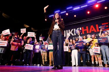 Republican presidential candidate Nikki Haley waves to supporters as she takes the stage...