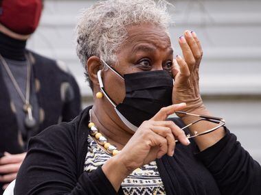 Marsha Jackson wipes her eyes while listening to opera singer Lawrence Brownlee perform...
