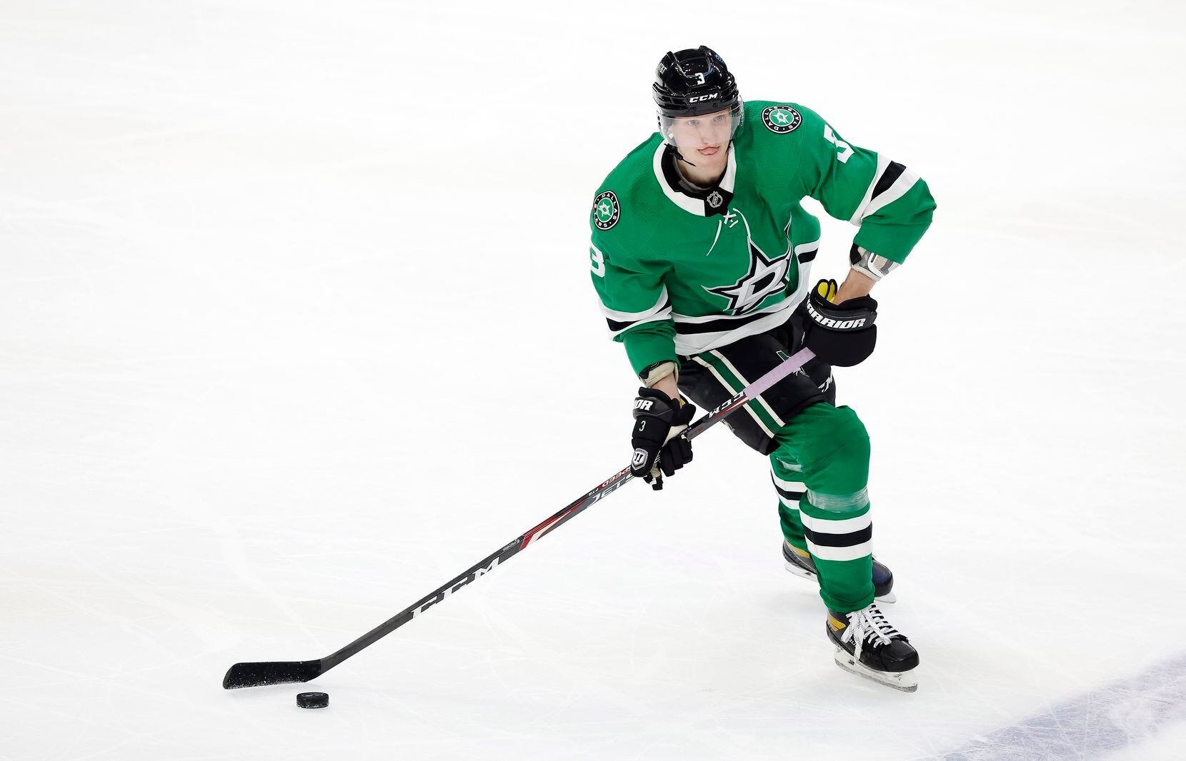 Dallas Stars defenseman John Klingberg (3) controls the puck at mid-ice the Stars play the Columbus Blue Jackets in the second period at the American Airlines Center in Dallas, Thursday, March 4, 2021.