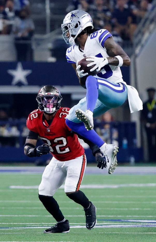 Dallas Cowboys wide receiver Noah Brown (85) skies over Tampa Bay Buccaneers safety Mike...