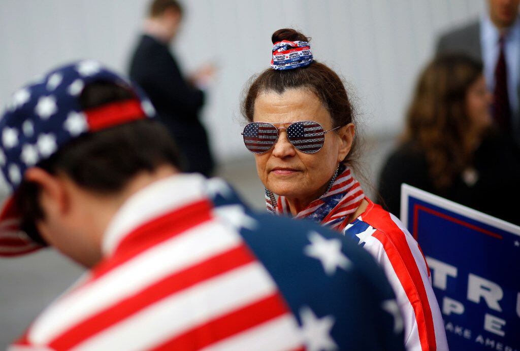 Donna Cancassi, a supporter of Republican presidential candidate Donald Trump, wears an...