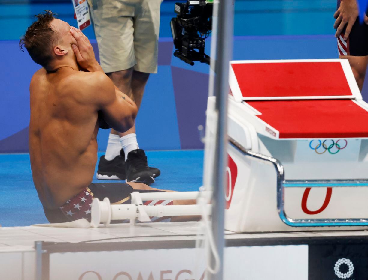 USA’s Caeleb Dressel celebrates after setting a new world record in the men’s 4x100 meter...