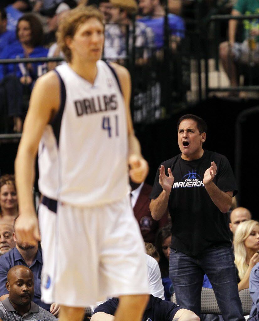 Dallas Mavericks owner Mark Cuban cheers on the team as Dallas Mavericks power forward Dirk...