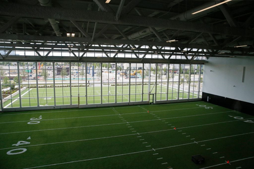 A football field that is half the length of regulation (60 yards) with a portion indoors at...