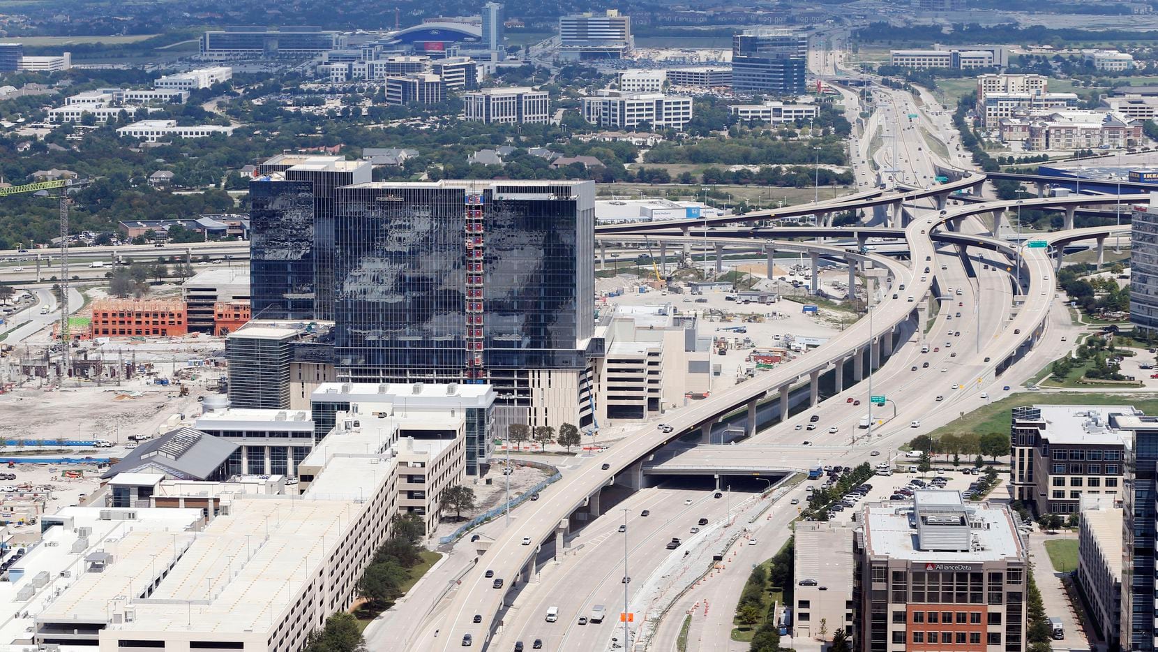 Dallas North Tollway splits Legacy West (left) and Shops of Legacy (right) in Plano on...
