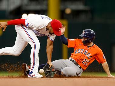Houston Astros second baseman Jose Altuve (27) safely steals second base as Texas Rangers...