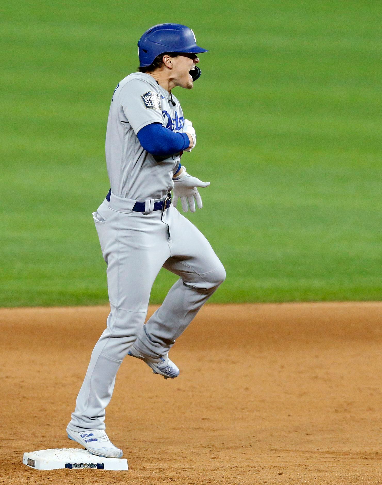 Photos: Randy Arozarena lays on home plate after game-winning run