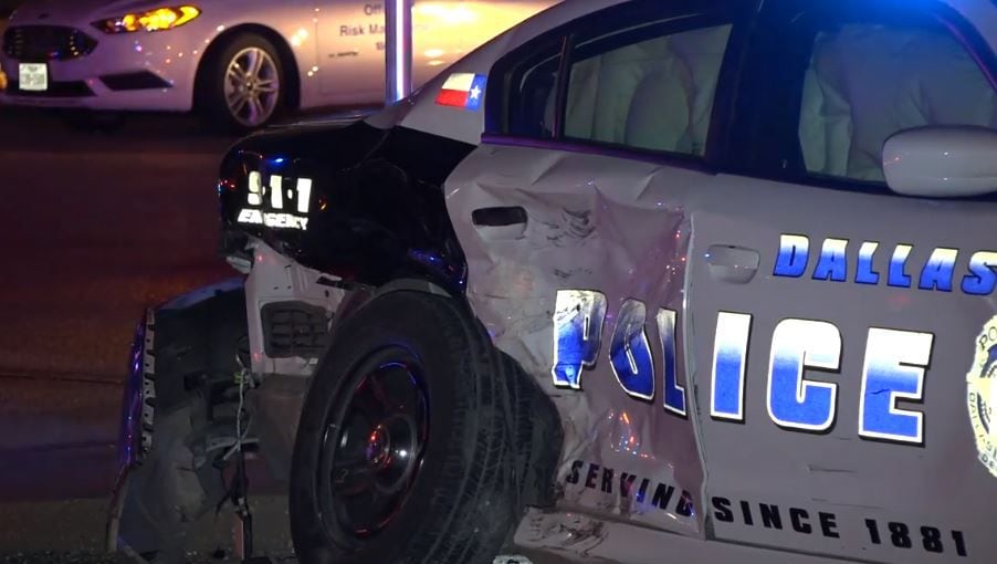 A Dallas police squad car was heavily damaged when it was hit by a possibly drunken driver...