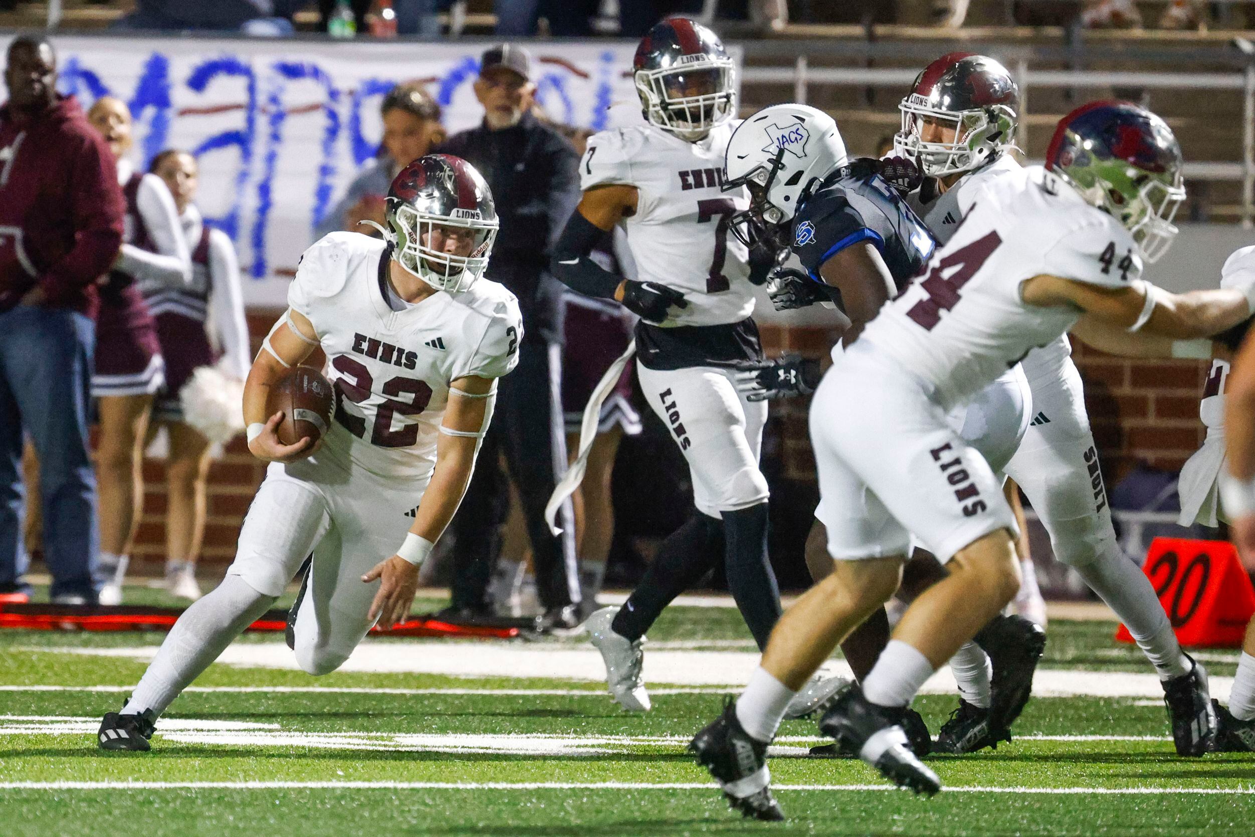 Ennis High school’s Malachi Perez (22) runs with the ball during the first half of a...