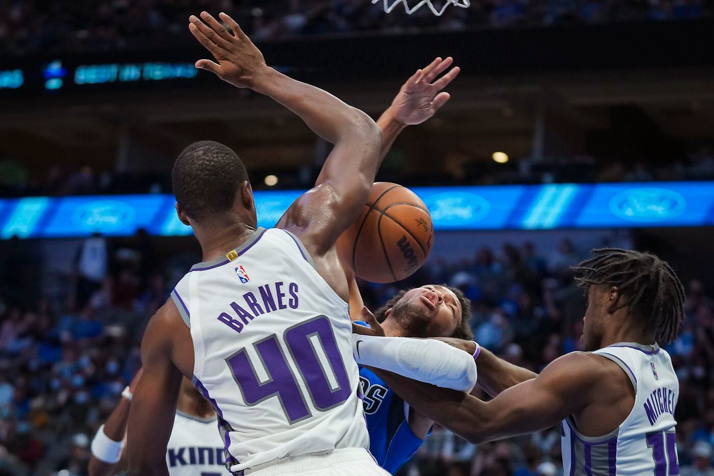 Dallas Mavericks guard Jalen Brunson (13) is tied up by Sacramento Kings guard Davion...