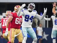 Dallas Cowboys defensive end Randy Gregory (94) reacts after a call went against the Cowboys during the first half of an NFL Wild Card playoff football game against the San Francisco 49ers at AT&T Stadium on Sunday, Jan. 16, 2022, in Arlington.