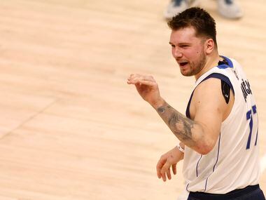Dallas Mavericks guard Luka Doncic (77) waves bye towards the stands after game 6 of an NBA...