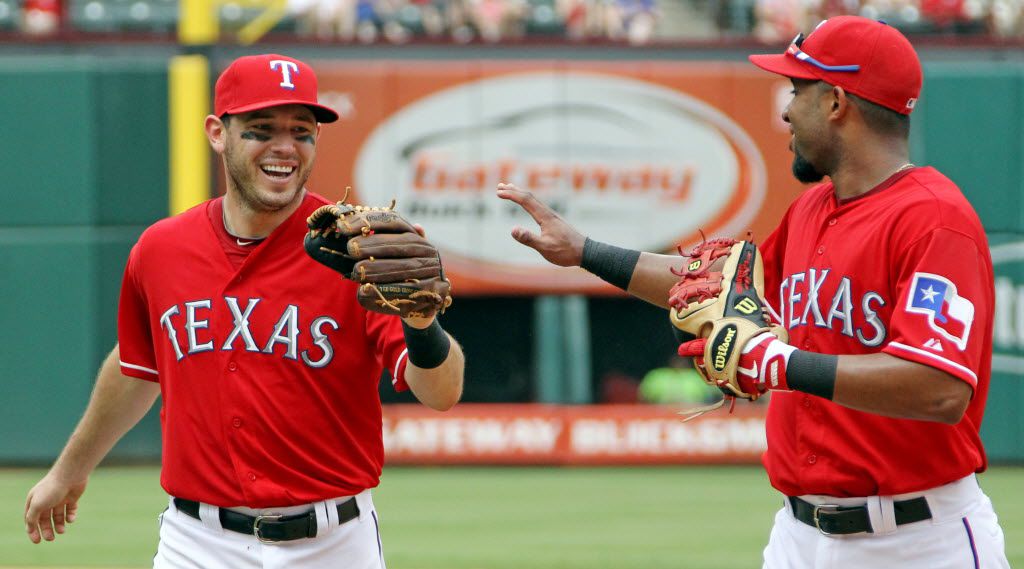 Texas Rangers second baseman Ian Kinsler (5) and  shortstop Elvis Andrus (1) are all smiles...