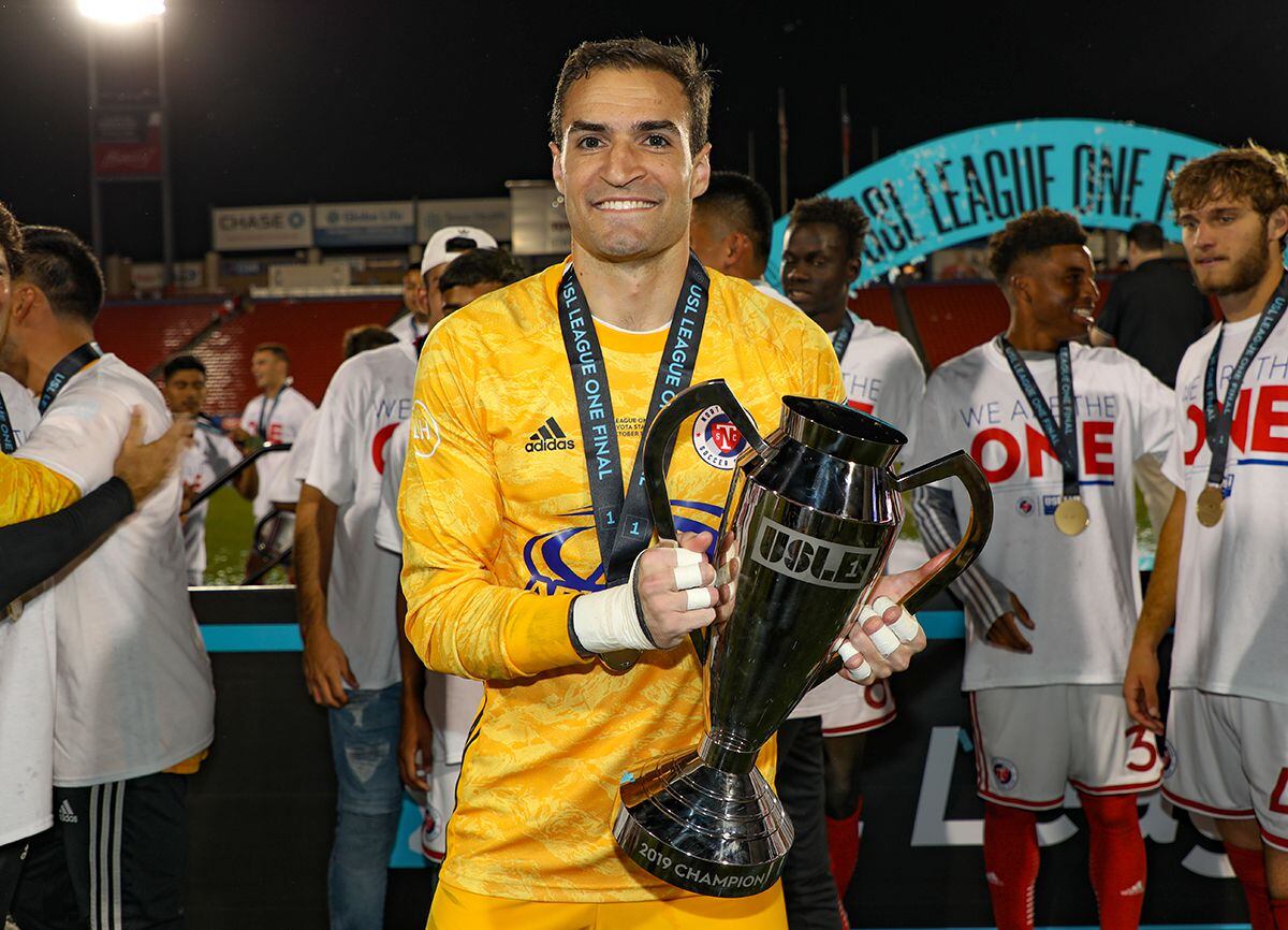 Kyle Zobeck of FC Dallas and North Texas SC celebrates with the USL-1 Championship trophy...